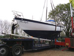 Blue Argolis being lifted onto a lo-loader by a crane.